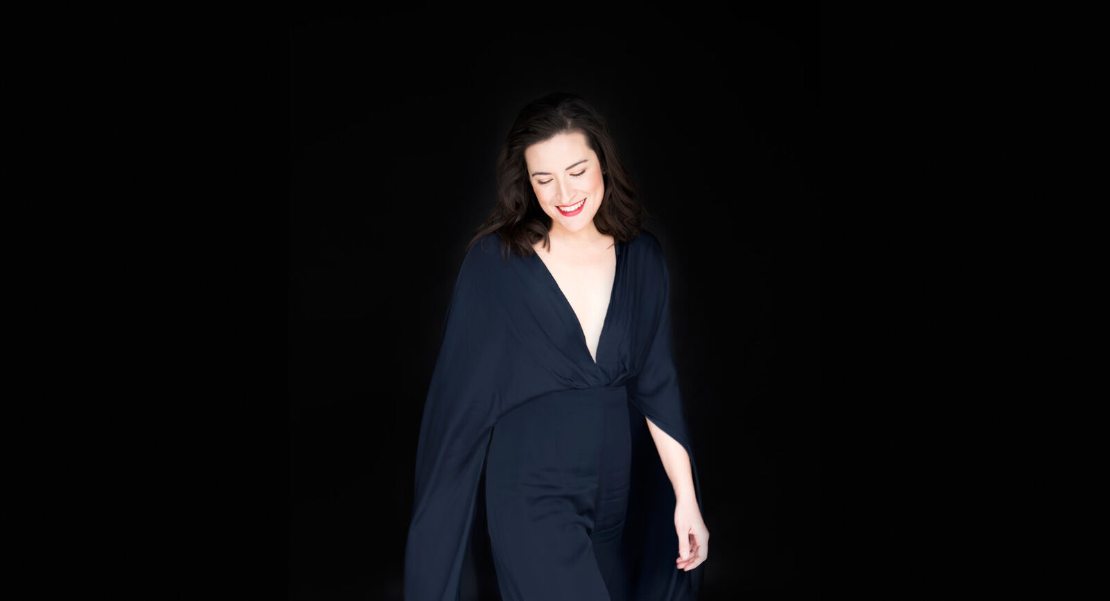 Ana Schwedhelm on a dark stage